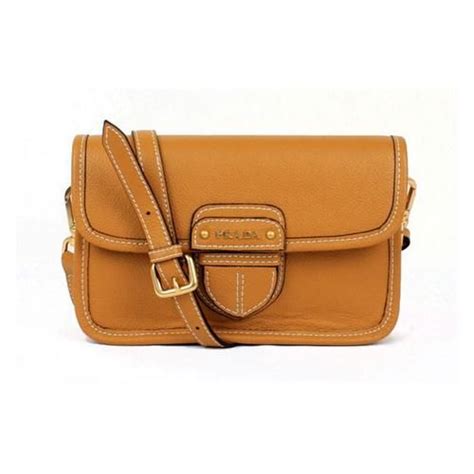 prada orange clutch|Prada leather backpack.